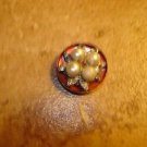 Bowl shape metal button with pearls and tiny rhinestones.