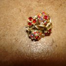 Intrique metal button with tiny aurora borealis like rhinestones.