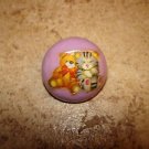 Dome shape plastic button with teddy bear and kitten. Dome shape plastic button with teddy bear and kitten.