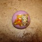 Dome shape plastic button with teddy bear and kitten.