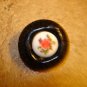 Large plastic button with embeded porcelain piece with rose.