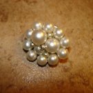 Vintage metal button with small and large pearls.