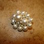 Vintage metal button with small and large pearls.