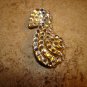 Large metal button in shape of Mother goose with rhinestones.