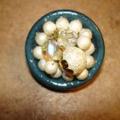 Large wood button with glass beads and pearls.