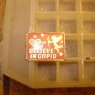 Gold metal pinback pins "I believe in Cupid". Gold metal pinback pins "I believe in Cupid".