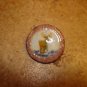 Large plastic button with moose animal.