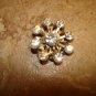 Old snowflake like metal button with Swarowski crystals.