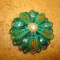 Large intrique plastic button with rhinestones and tiny pearls.
