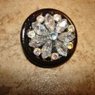 Hard plastic button with tier shape glass beads and rhinestones. Hard plastic button with tier shape glass beads and rhinestones.