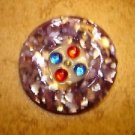 Large faux tortoise sheel button with rhinestones.
