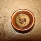 Vintage celluloid button with tiny bird. Vintage celluloid button with tiny bird.
