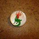 Old mother of pearl button with flaming Chinese dragon.