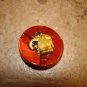 Large plastic button with funny elephant.