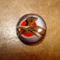 Mother of pearl button with flying eagle.