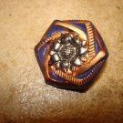 Dark blue and gold plastic button with sunflower. Dark blue and gold plastic button with sunflower.