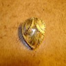 Art nouveau style tier shape metal button.