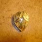 Art nouveau style tier shape metal button.