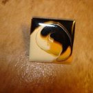 Square art nouveau style metal button. Square art nouveau style metal button.