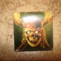 Large square metal button Pirates of Caribbean.