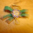Bow shape metal button with tiny blue rhinestones. Bow shape metal button with tiny blue rhinestones.