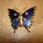 Large metal and cloisane button in shape of butterfly.