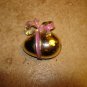 Metal Easter egg button with large bow.