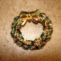 Christmas wreath BROOCHE pin with tiny red rhinestones.
