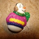Lovely snowman button with colorful sweater and scarf. Lovely snowman button with colorful sweater and scarf.