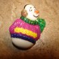 Lovely snowman button with colorful sweater and scarf.