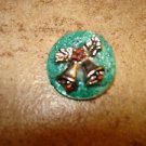 Mother of pearl Christmas button with bells. Mother of pearl Christmas button with bells.