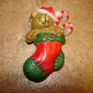 Cute Christmas plastic button teddy bear in Christmas stocking. Cute Christmas plastic button teddy bear in Christmas stocking.