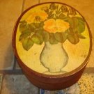 Old oval shape wood box with painted vase & flowers.