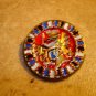Large metal button with Japanese dragon.