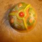 Bunt cake shape colorful plastic button.
