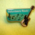 Volunteers Rock! metal pin back pin.