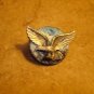 Large metal button with bold eagle bird