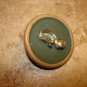 Large wood button with quilter tool.