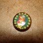 Vegetable ivory button with tropical bird.
