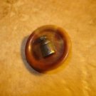 Vegetable ivory button with old metal milk bottle. Vegetable ivory button with old metal milk bottle.