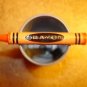 Metal pewter button in shape of orange Crayon