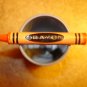 Metal pewter button in shape of orange Crayon