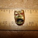 Old brass and mother of pearl button  Phantom of the opera.