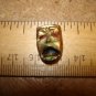 Old brass and mother of pearl button  Phantom of the opera.