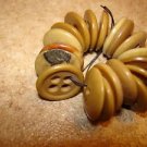 Lot of 19 earth color small plastic buttons.