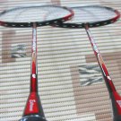 Badminton racket, shuttles and grips.