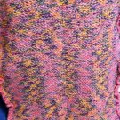 Crocheted Pink Receiving Blanket with Purple, Yellow, & Green Accents.