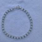 White ankle bracelet
