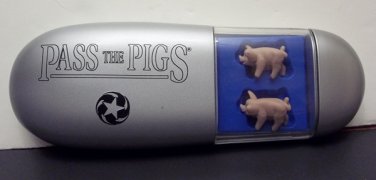 Pass the Pigs Game in case w/instructions, score pad, and pigs