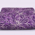 Missoni bedspreads with stylized leaves on purple colors for double bed